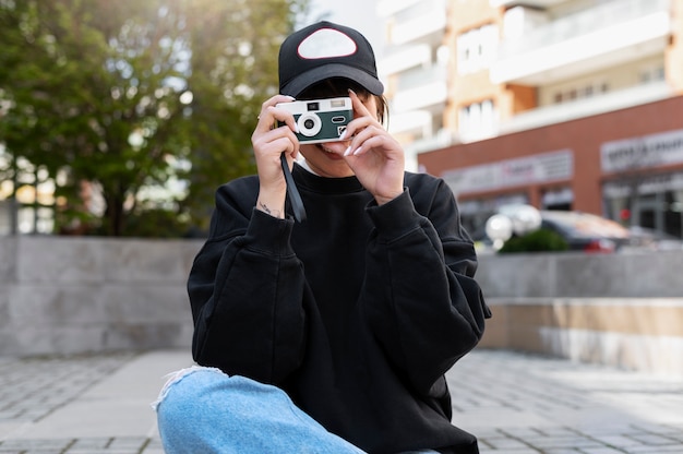 Young Woman in Trucker Hat – Free Stock Photo for Download