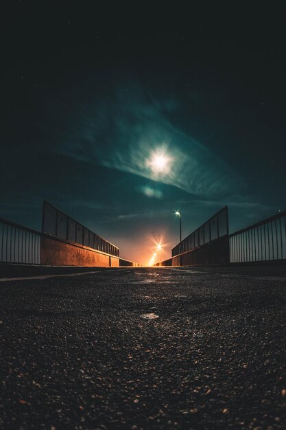 Stunning Night View of an Illuminated Bridge Against the Sky – Free Download