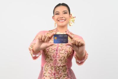 Young Beautiful Woman in Local Southern Culture Holding a Credit Card – Free Download