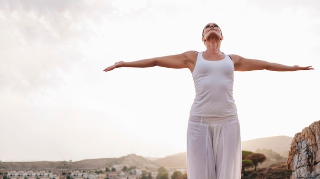 Peaceful Woman Stretching Her Arms – Free Stock Photo for Download