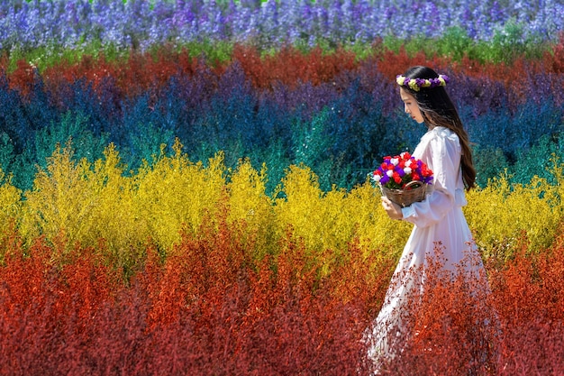 Beautiful Girl in White Dress Surrounded by Colorful Rainbow Flowers in Chiang Mai – Free Download