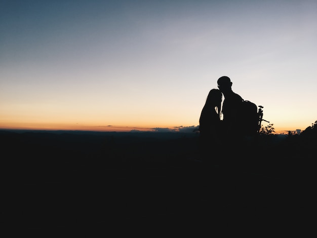 Silhouette of a Couple in the Mountains – Free Download