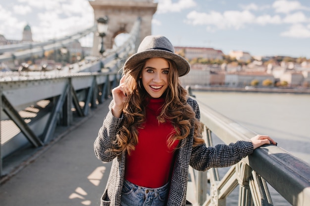 White Female Model in Hat Posing by River – Free Stock Photo, Download for Free