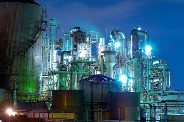 Illuminated Factory at Night – Low Angle View | Free Download