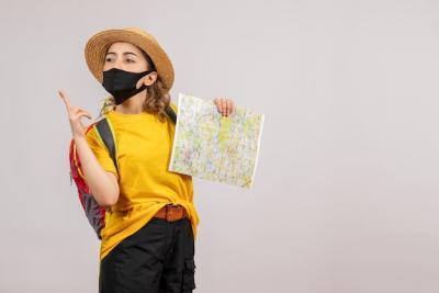 Young Traveller with Backpack Holding Map – Free to Download