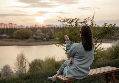 The View of a Girl Watching the Sunset from a Bench – Free Download