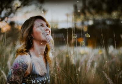 Happy Woman Amidst Plants at Sunset – Free Download, Free Stock Photo