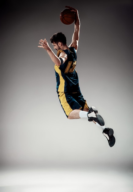 Full-Length Portrait of a Basketball Player with Ball – Free Download