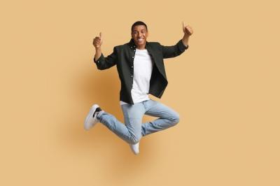 Happy Black Man Jumping and Giving Thumbs Up – Free Download