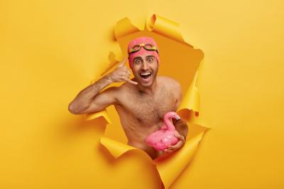 Happy Man in Swim Gear with Pink Flamingo – Free Stock Photo for Download