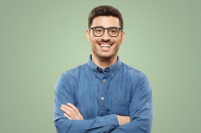 Businessman in Blue Shirt and Glasses with Arms Crossed – Free Stock Photo for Download
