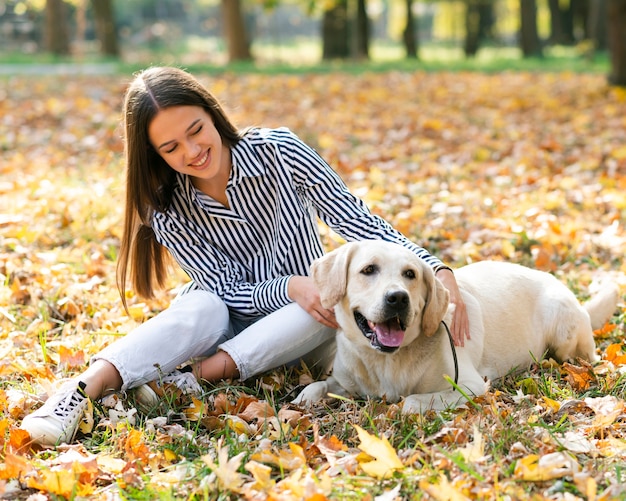 Smiley Young Woman Enjoying Time with Her Dog – Free Download