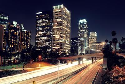 Nighttime View of Downtown Los Angeles with Urban Buildings and Light Trails – Free Download