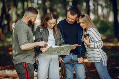 Four Friends Relaxing in a Serene Forest – Free Download Stock Photo