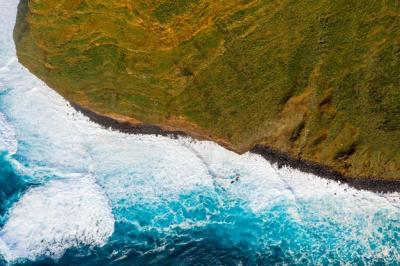 Aerial View of Ocean Island Cliffs with Huge White Waves and Crystal Blue Water – Free to Download