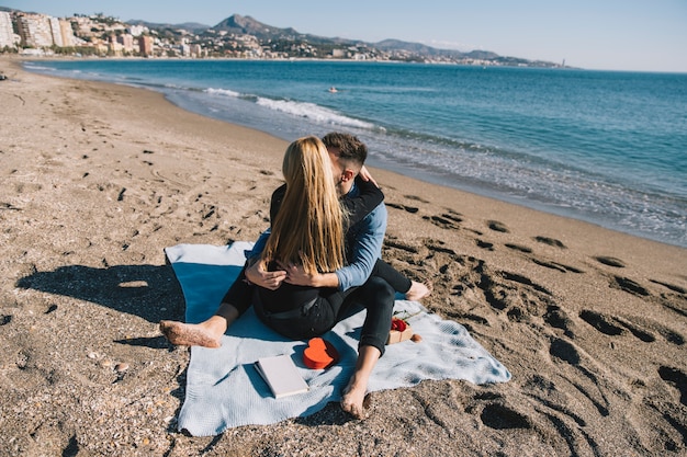 Content Couple Embracing on Shoreline – Free to Download