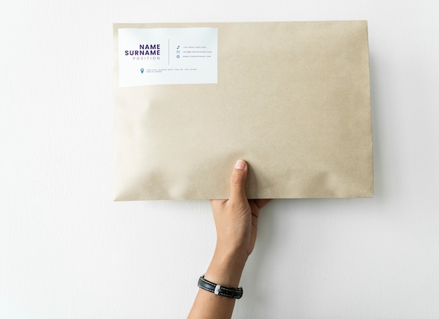 Package Mockup Held by Woman – Free Download