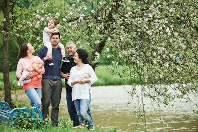 Family Portrait Near a Lake and Bench: Download Free Stock Photo