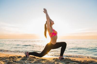 Sporty Young Woman Exercising on Sunrise Beach – Free to Download