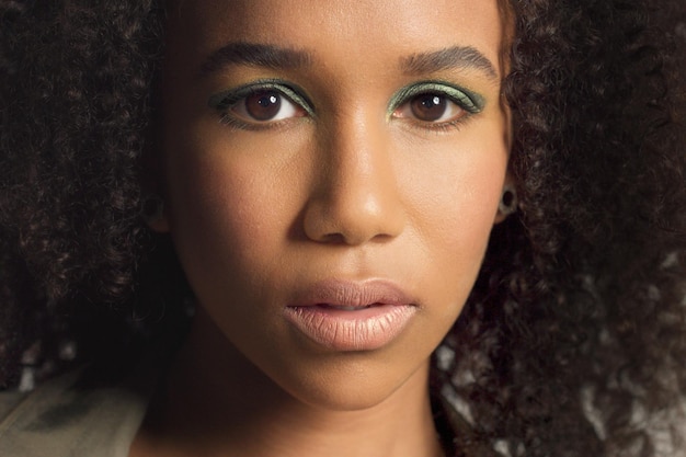 Closeup Portrait of Young Mixed Race Model with Curly Hair and Green Metallic Eyeshadows – Free Stock Photo, Download Free