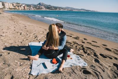 Couple Embracing on Shoreline – Free to Download