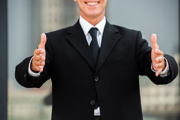 Businessman with Palms Facing Each Other – Free to Download Stock Photo