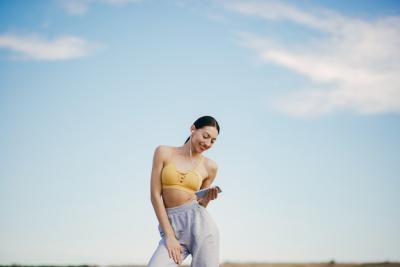 Cute Girl Training with Phone Under a blue Sky – Free Stock Photo, Download Free