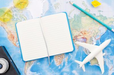 World Map and Travel Notebook – Download Free Stock Photo