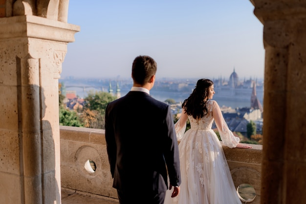 Wedding Couple Enjoying a Sunny Day with Scenic Town View – Free Stock Photo, Download for Free