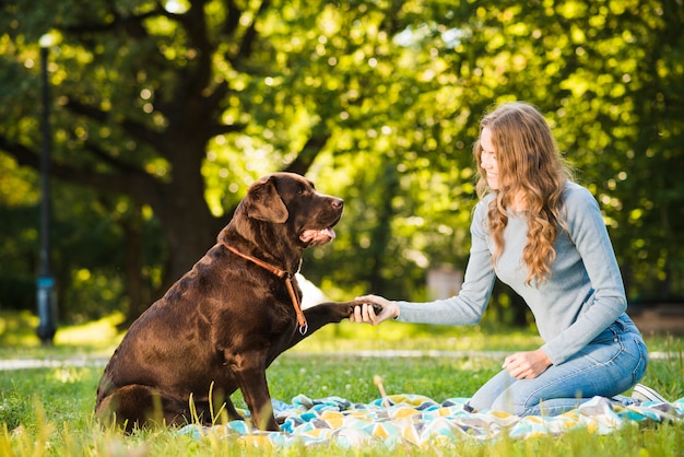 Beautiful Young Woman with Dog in Garden – Free Stock Photo, Download Free