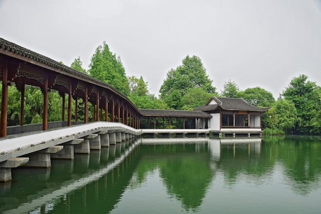 Stunning Landscape Featuring Trees and a Stone Bridge – Free Download