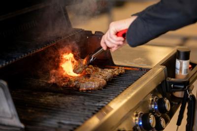 Close-Up Hand Making Barbeque – Free Stock Photo, Download Free