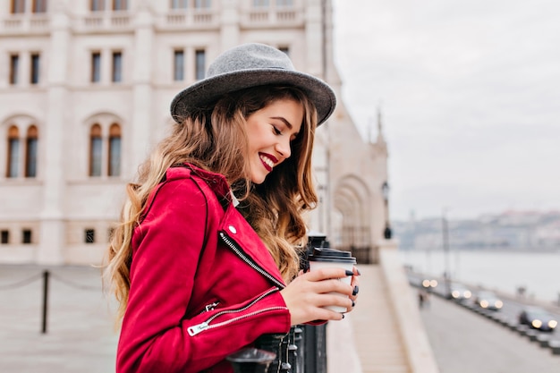 Cute Woman Laughing in Gray Hat on a Cold Spring Morning – Free Stock Photo for Download