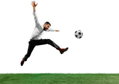 Young Businessman Playing Football on White Background – Free Stock Photo for Download