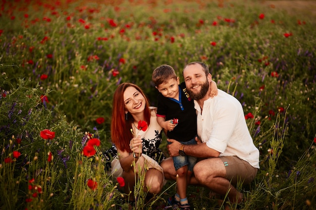 Parents with Their Son in a Green Field of Poppies – Free Download