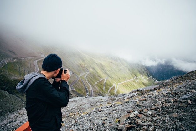 Tourist Capturing Stunning Nature Landscapes with Smartphone – Free Download