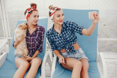 Stylish Pin-Up Girls with a Little Dog – Free Download