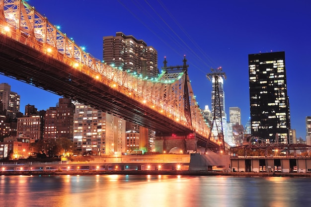 Queensboro Bridge at Sunset with Reflections of Midtown Manhattan – Free Download