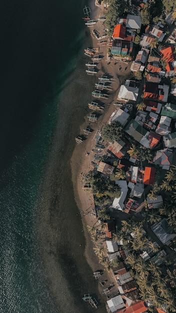 Aerial Shot of a Small Fishing Village in a Countryside Island in the Philippines – Free to Download