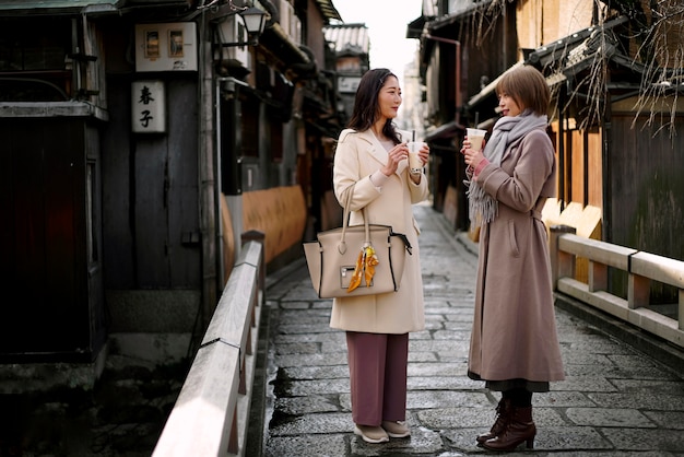 Full Shot of Young Women Enjoying Bubble Tea – Free Download