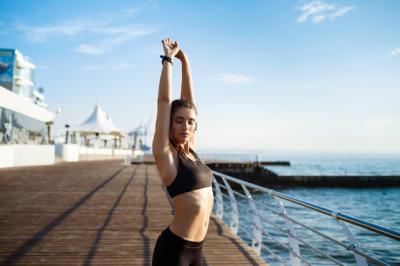 Young Beautiful Fitness Woman Exercising by the Sea Coast – Free Download