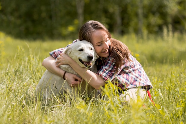 Woman Enjoying a Dog in the Countryside – Free Stock Photo for Download