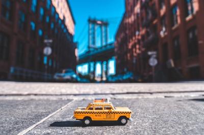 Closeup Shot of a Taxi Model on Washington Street, New York, USA – Free to Download