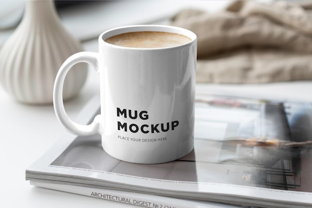 A Mug Mockup on a Magazine on the Table – Free Download, Free Stock Photo