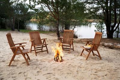 High Angle View of Empty Chairs Surrounding a Bonfire – Free Download