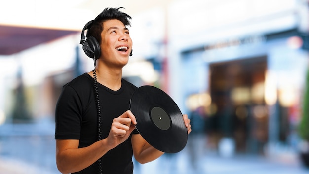 Happy Teenager Holding a Vinyl – Free Stock Photo, Download for Free