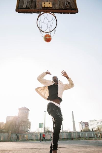 Teenager Playing Basketball Outdoors – Free Download