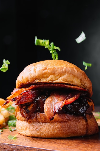 Delicious Bacon Burger on Black Wall – Free Stock Photo for Download