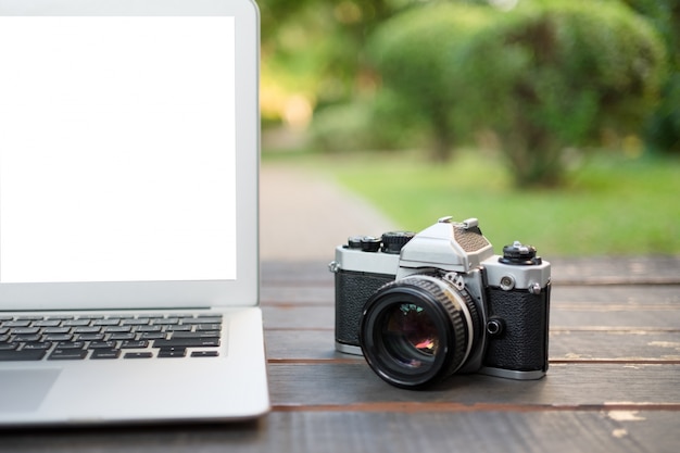 White Screen Laptop and Vintage Camera – Free Stock Photo for Download