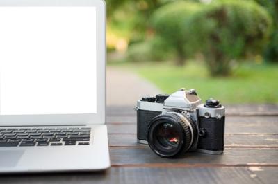 White Screen Laptop and Vintage Camera – Free Stock Photo for Download